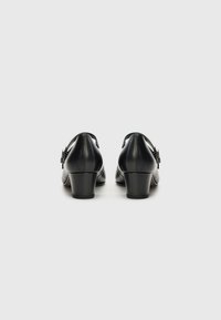 Black leather block-heeled shoes with a rounded back. Features a silver buckle accent on the side and a smooth, glossy finish.