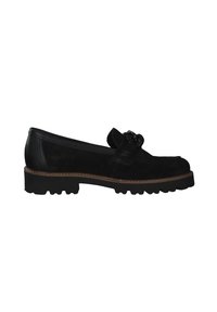 Schwarze Wildleder-Slipper mit runder Zehenpartie, dekorativem Bogen am Obermaterial und einer robusten schwarzen Gummisohle. Beige Nahtdetails entlang der Kante.
