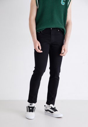 SUPER STRETCH - Vaqueros tapered - black