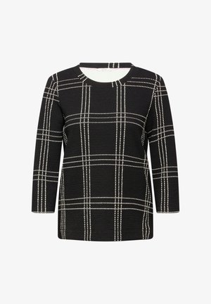 Mustat pitkät hihat -paita, joka on valmistettu teksturoidusta kankaasta, jossa on valkoinen ruutukuosi ja pistekoristeet. Pyöreä kaula-aukko ja rento istuvuus.