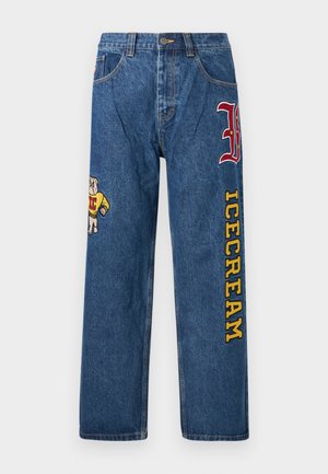 Lyseblå denimjeans med løs passform. Har en brodert hund på venstre ben og teksten "ICECREAM" i gult på høyre ben.