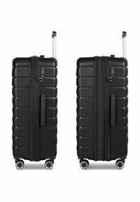 Valigia rigida con ruote di colore nero opaco, caratterizzata da un design rigato, maniglia estraibile e serratura approvata TSA. Ruote scorrevoli senza problemi.