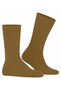 Braune, gerippte Baumwollsocken mit einer Höhe bis zur Mitte der Wade, ausgestattet mit verstärktem Fersen- und Zehenbereich. Schlichtes Design mit einem dezente Logo-Detail an der Sohle.