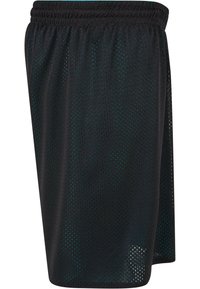 Svart mesh trening shorts med pustende stoff, elastisk midje og løs passform, designet for komfort og bevegelighet under aktivitet.