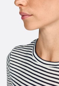 Striped shirt with navy and white horizontal lines, cotton material, crew neck design, and visible neckline. Skin tone in close-up view.