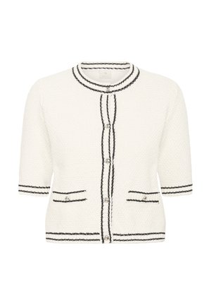 Cardigan blanc texturé avec bordure noire, manches courtes, encolure ronde et deux poches frontales. Fermeture à boutons avec accents décoratifs.