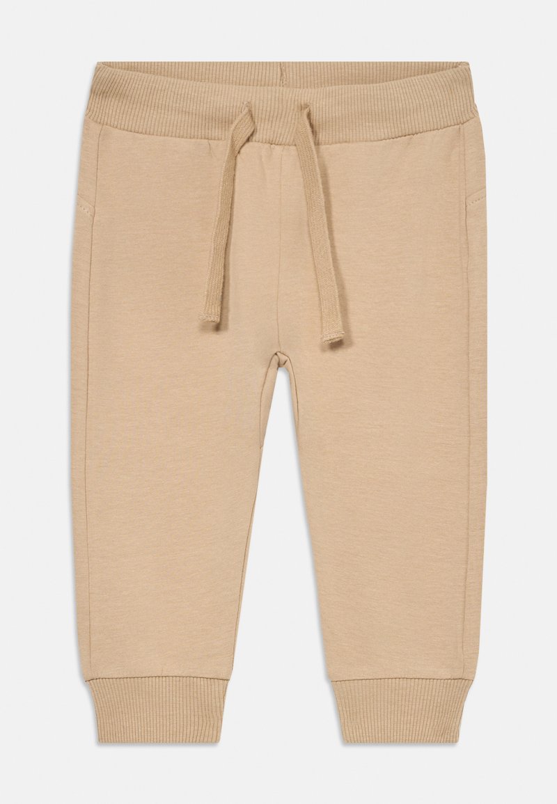 Beige Jogginghosen aus weichem Stoff, mit einem gerippten Bund, Kordelzug und eng anliegenden Bündchen. Mit praktischen Seitentaschen ausgestattet.