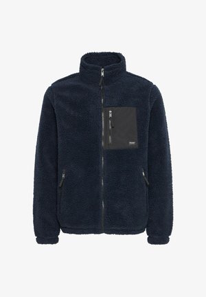 Jūras spēku mikrofleece jaka ar augstu apkakli, ar rāvējslēdzēju priekšpusē un melnu krūšu kabatu. Iekļauj divas sānu kabatas ar rāvējslēdzēju un teksturētu audumu.