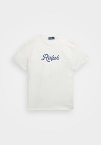 White cotton T-shirt featuring a curved navy blue "Ralph" logo on the front. Crew neck design with short sleeves, standard fit.