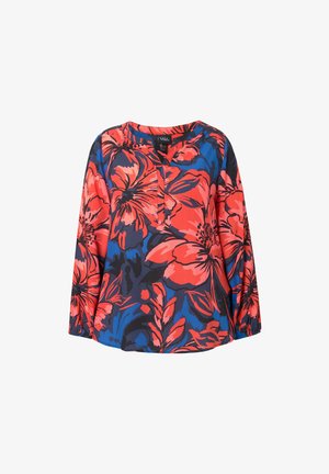Kwiatowa bluzka w kolorze czerwonym, niebieskim i czarnym. Posiada dekolt w kształcie litery V, długie rękawy oraz luźny krój z dużymi, wyraźnymi wzorami kwiatowymi w całej szacie.