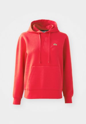 Rood hoodie gemaakt van een katoenmix. Bevat een kangoeroezak, ribgebreide manchetten en een klein groen logo op de linkerborst.