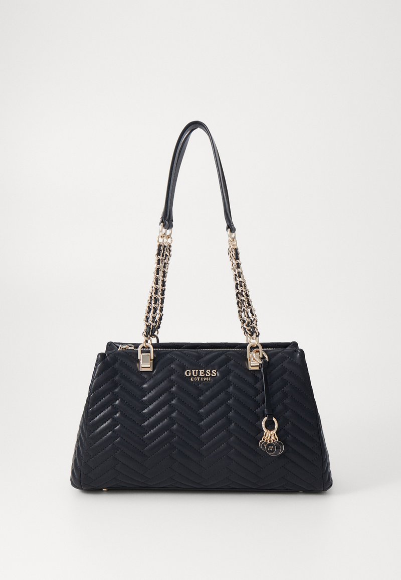 Black quilted handbag with a structured shape, featuring dual chain and leather handles, gold-tone hardware, and branded logo detail.