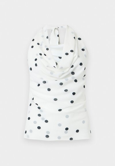 Haut dos-nu blanc à pois noirs et gris, avec un col bénitier et une fermeture à nouer dans le dos.