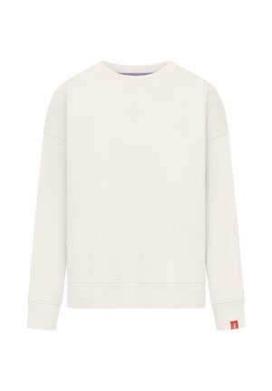 Plain cream-colored long-sleeve sweatshirt with crew neck, subtle embossed logo on chest, and small red tag on left wrist cuff.