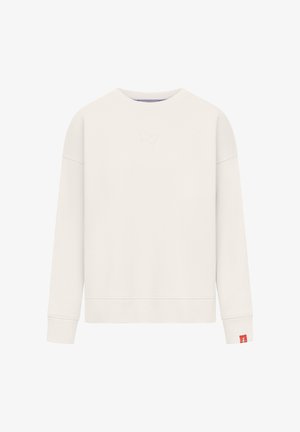 Prosta kremowa bluza z długim rękawem i okrągłym dekoltem, z subtelnym wytłoczonym logo na piersi oraz małą czerwonym metką na mankiecie lewego nadgarstka.