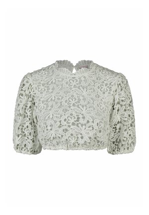 Blouse courte en dentelle blanche avec manches bouffantes et col haut festonné, présentant un motif floral et une fermeture à bouton en forme de clé à l'arrière.