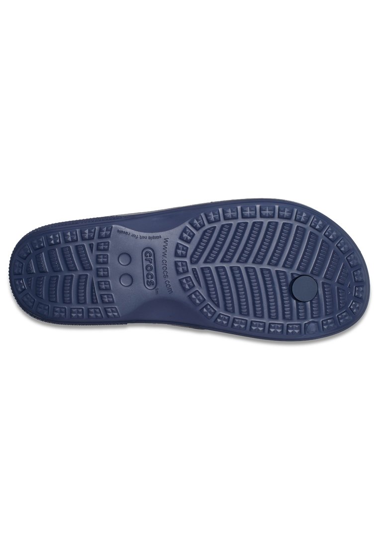 Marine-gummi-Außensohle mit strukturiertem Profil und erhöhten Mustern für besseren Halt. Mit rundem Logo und Ablauflöchern für Wasserbeständigkeit.