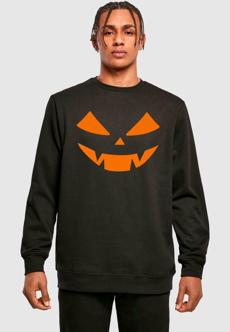 Felpa nera con un grande design di faccia di zucca arancione con denti frastagliati; polsini e orlo a coste.