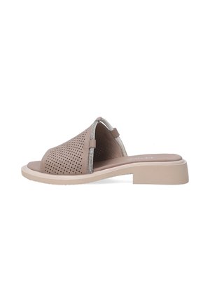 Tan perforated slide sandal with a low block heel, featuring a decorative silver accent along the opening and a smooth footbed.