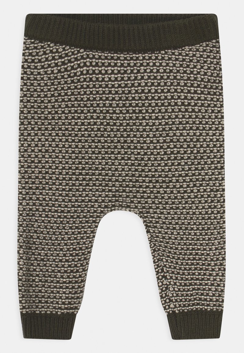 Pantalon bébé tricoté avec motif moucheté noir et blanc, taille et poignets côtelés noirs.