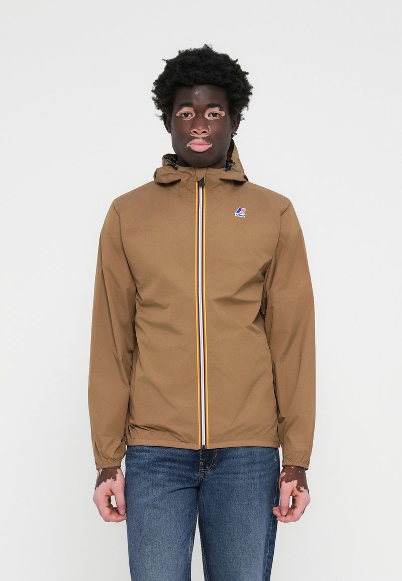 Brown waterproof jacket with a hood, featuring a front zipper with a multicolored stripe and a small logo on the chest.
