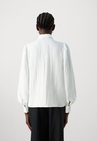 JDY JDYTRAIN - Blouse - cloud dancer
