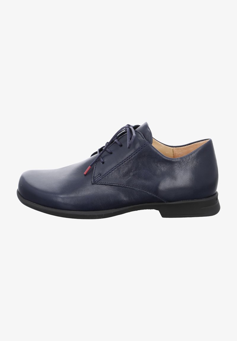 Navy blue leather dress shoe with a smooth texture, low profile, and tonal laces. Features a subtle red accent near the eyelet.