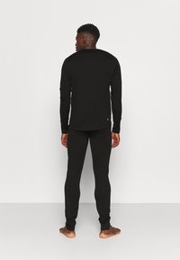 Rukka TIILAJA - Pitkät alushousut - black