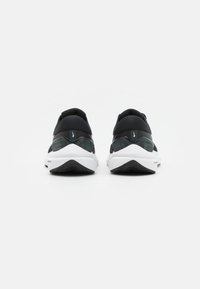 Black and grey athletic shoes with a smooth fabric upper, padded collar, and white sole featuring a textured black rubber outsole.