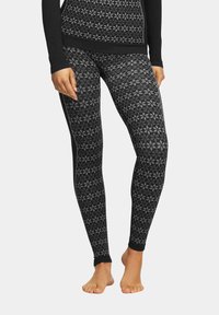 Czarne legginsy z geometrycznym wzorem w odcieniach szarości, wykonane z elastycznego materiału, z dopasowanym krojem i haftowanym paskiem w talii.