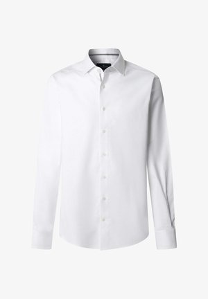 Camicia bianca a maniche lunghe realizzata in tessuto liscio, con colletto classico e chiusura frontale con bottoni. Presenta polsini con bottoni e orlo arrotondato.