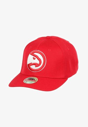 Red cap with a curved brim, featuring a white embroidered logo of a hawk on the front. Made from a textured fabric.