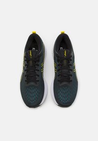 ASICS GEL-EXCITE 10 - Utcai futócipők - black/bright yellow