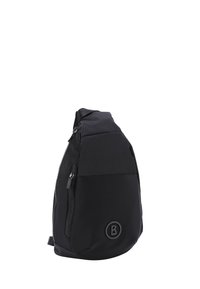 Borsa a tracolla nera realizzata in tessuto resistente, con un vano con zip, un pannello testurizzato e un dettaglio logo circolare sul fondo.