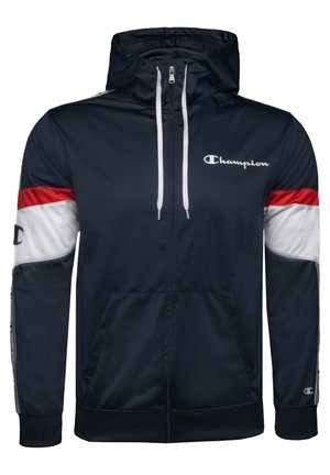 Granatowa bluza z kapturem na zamek błyskawiczny z czerwonymi i białymi paskami na rękawach, białymi sznurkami, logo Champion na piersi i mankietach, przednimi kieszeniami i kapturem.