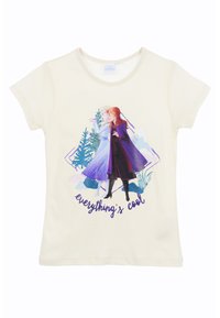 Camiseta crema de manga corta con un estampado gráfico de dos personajes y el texto "todo está bien" en morado.