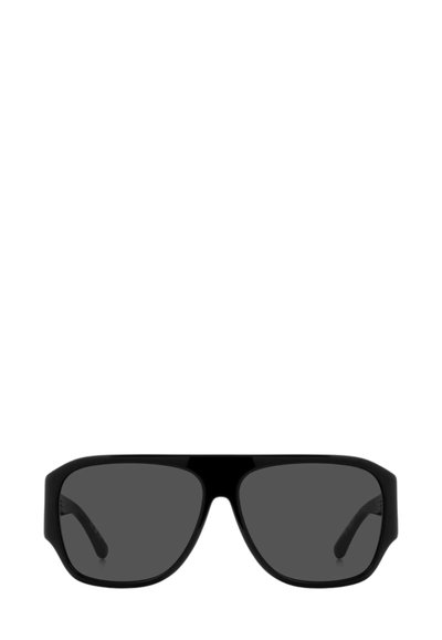 Occhiali da sole oversize quadrati neri con lenti scure e montatura spessa, mostrati frontalmente su sfondo bianco.