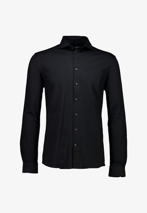 Svart långärmad skjorta tillverkad av slätt tyg. Har en spetsig krage, knappslå och manschetter med knappstängningar.