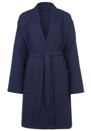 Accappatoio di spugna blu navy a rilievo con maniche lunghe, cintura a fiocco e due tasche frontali. Texture morbida e design con apertura frontale. Taglia S/M.