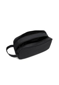 Black rectangular toiletry bag made of textured fabric, featuring two zippered compartments and a side handle for carrying.