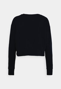 Sudadera negra de manga larga y cropped con puños acanalados y cuello redondo, vista desde la parte trasera sobre un fondo blanco.