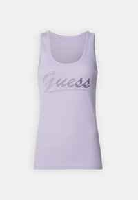 Top in lavanda a coste con logo "Guess" in argento metallizzato decorato con strass sulla parte anteriore. Collo rotondo e senza maniche.