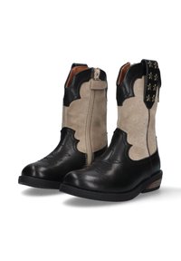 Stivaletti alla caviglia in pelle nera e suede beige con cuciture decorative, zip laterale e dettagli a forma di stella sul retro. Suola spessa.