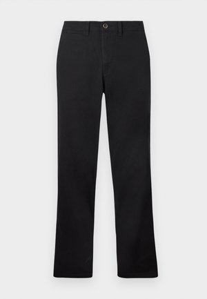 Zwarte broek opgesteld tegen een witte achtergrond, met een recht model en een knoopsluiting in de taille.