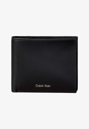 Mustast nahast kahekordne rahakott nähtava õmblusega ja hõbedase Calvin Kleini logoga esiküljel all paremas nurgas.