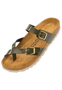 Grön patentklämmad sandal med två justerbara spännen, korksula och en oljad, texturerad brunt innersula på en ljus sula.