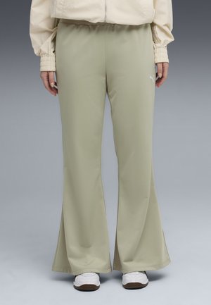Pantaloni sportivi svasati verde chiaro realizzati in tessuto morbido, con vita elastica e un piccolo logo bianco sulla coscia.