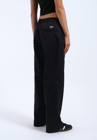 Dr.Denim HILL - Trousers - black