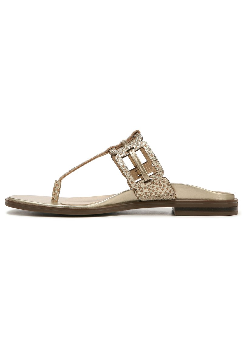 Gold thong sandals with textured straps and a large geometric buckle accent. Flat sole with a slight sheen and a smooth footbed.