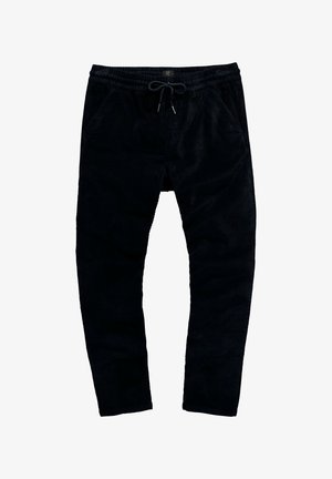 Pantalones jogger de pana negra con cintura ajustable, dos bolsillos laterales y diseño de pierna ajustada. Textura suave con estrías verticales.